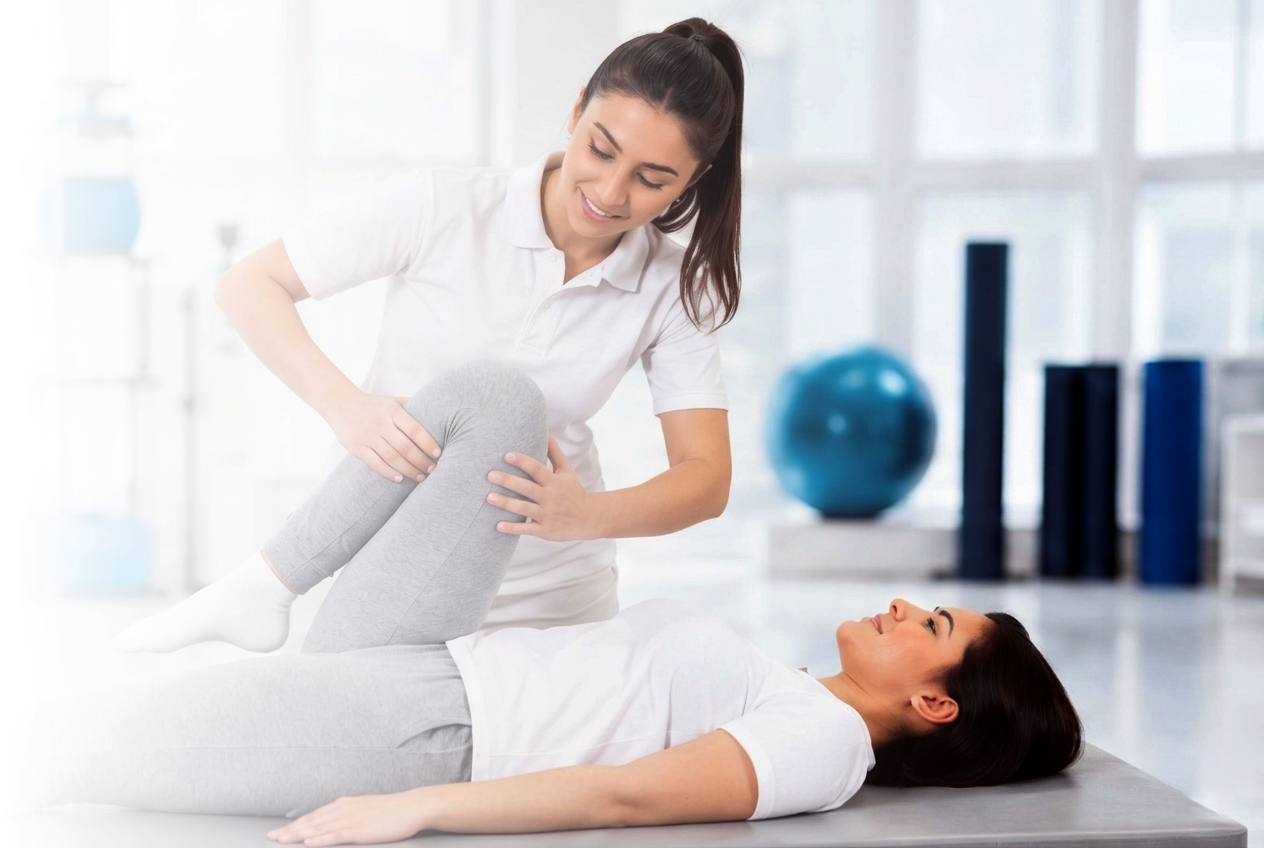 Physiotherapist helping a patient with leg movement